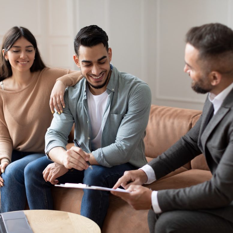 real-estate-agent-showing-buyers-contract-man-signing.jpg